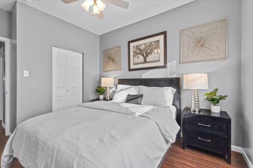 a bedroom with a large bed and a ceiling fan at Sleep 5 - Pet & Baby - Laundry - Closer to Hospitals in Indianapolis