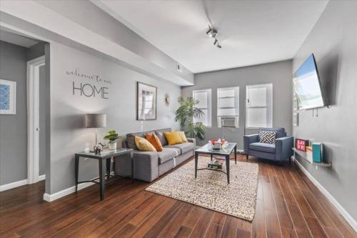 a living room with a couch and a table at Sleep 5 - Pet & Baby - Laundry - Closer to Hospitals in Indianapolis
