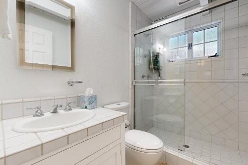 a bathroom with a toilet and a sink and a shower at The Great Escape in Arnold