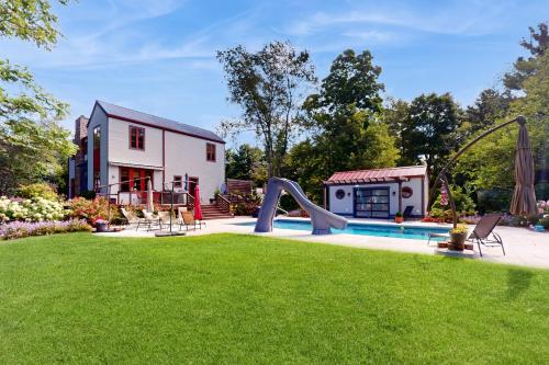 a backyard with a pool and a slide at Lake Bluff in Watervliet