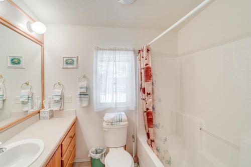 a bathroom with a toilet and a sink and a shower at Peaceful Entiat Home Pets Welcome! in Entiat