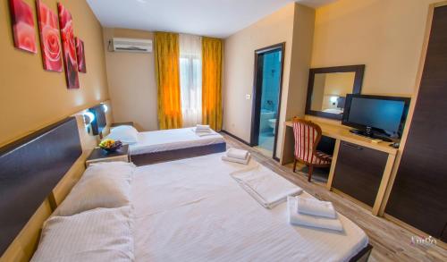 Ένα ή περισσότερα κρεβάτια σε δωμάτιο στο Apartments Cavaliero