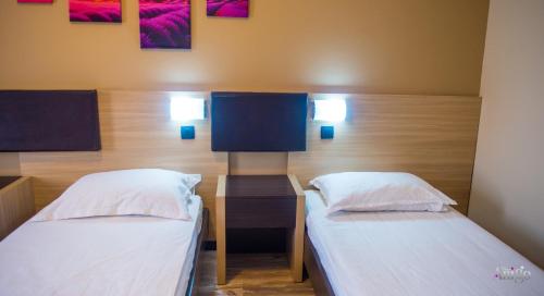 Ένα ή περισσότερα κρεβάτια σε δωμάτιο στο Apartments Cavaliero