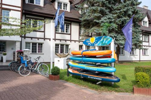 a stack of inflatable tubes in front of a house at Great Polonia Beach & Molo in Puck