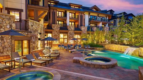 a hotel with a swimming pool and a resort at The Sebastian - Vail King Hotel Room in Vail