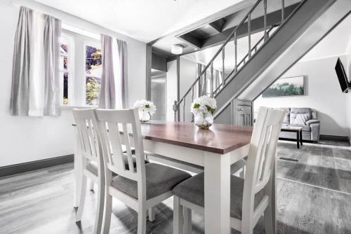 a dining room with a table and two chairs at Comfortable 5BR 2BA near the falls in Niagara Falls