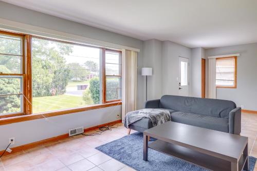 a living room with a couch and a table at Pet-Friendly New Berlin Retreat with Patio and Yard! in New Berlin