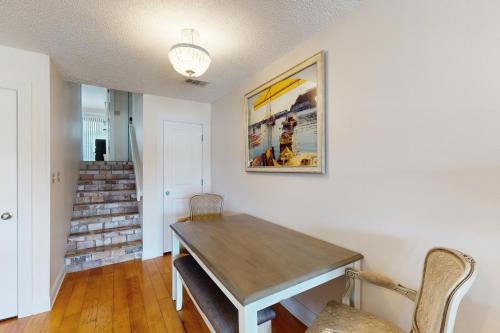 a dining room with a wooden table and chairs at Ocean Mile L7 Gulf Beach Getaway in St. George Island