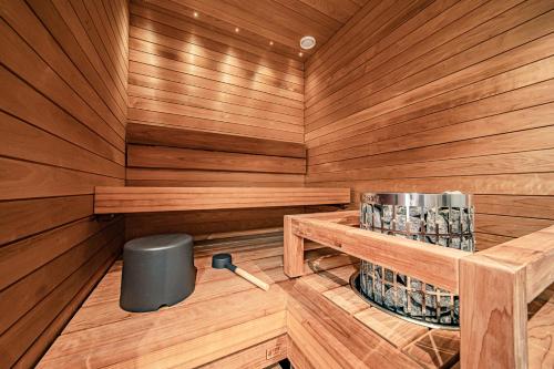 an inside of a sauna with a trash can at Ski Chalet C8 Levi Center incl 2 ski passes by Aavalevi in Levi