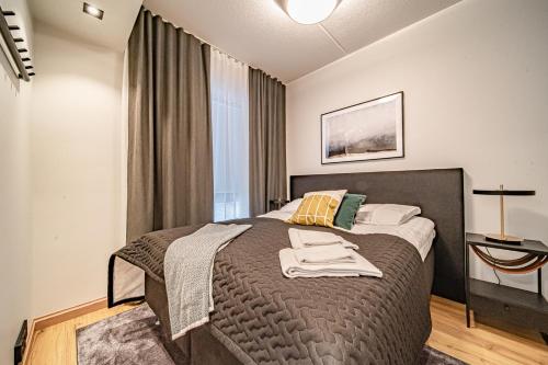 a bedroom with a large bed in a room at Ski Chalet C8 Levi Center incl 2 ski passes by Aavalevi in Levi