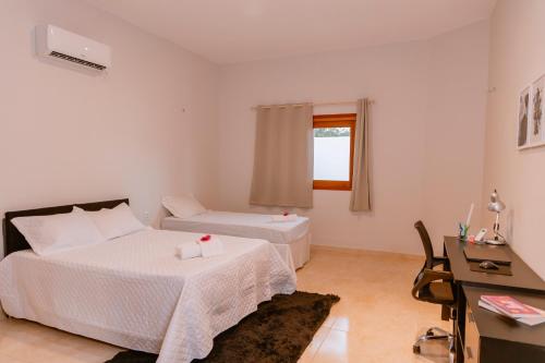 Postel nebo postele na pokoji v ubytování Casa Irashai