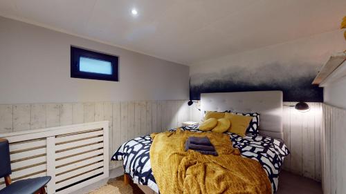 a bedroom with a bed with a stuffed animal on it at Lo-Ghis Vakantieappartement Voerstreek 4P - 2slpk in Voeren