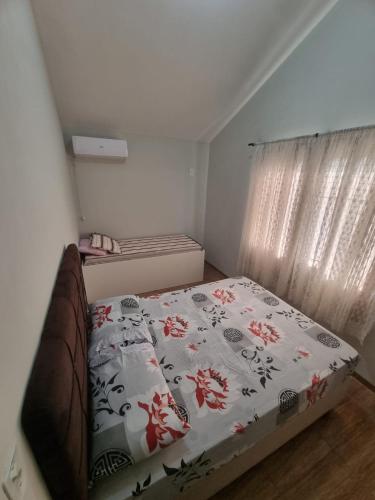 a small bedroom with a bed with a blanket at Kamke's Haus III in Pomerode