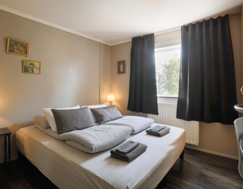 Postel nebo postele na pokoji v ubytování Karuna Guesthouse