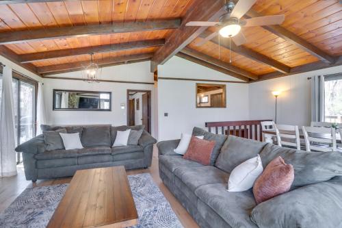 a living room with two couches and a wooden ceiling at McGaheysville Vacation Rental Yard and Fire Pit! in McGaheysville