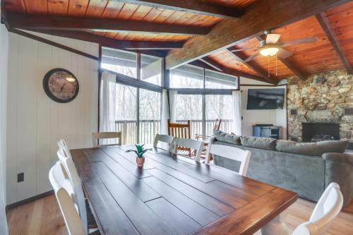 a dining room with a wooden table and chairs at McGaheysville Vacation Rental Yard and Fire Pit! in McGaheysville