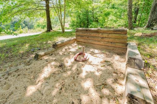 a wooden bench sitting in the dirt in a park at Big Kahuna Lodge cabin in Sevierville