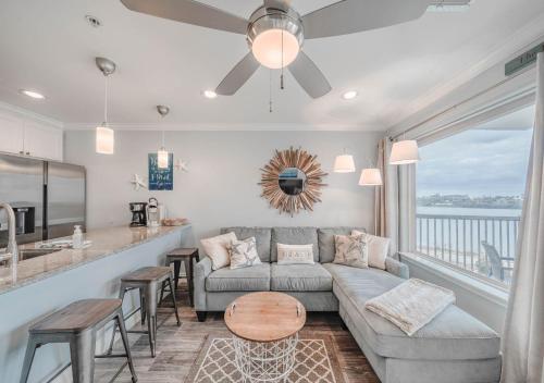 a living room with a couch and a table at Ocean View Luxury Steps to Beach in Galveston