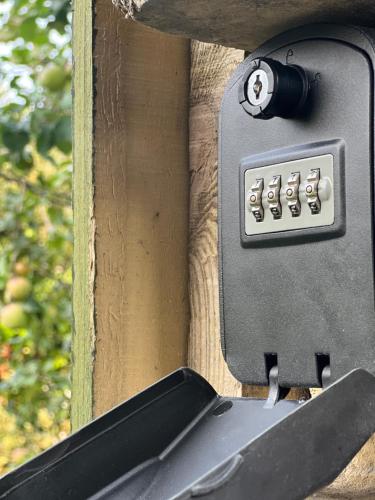 an outdoor object with a knife sticking out of it at The Cabin in Bradford on Avon