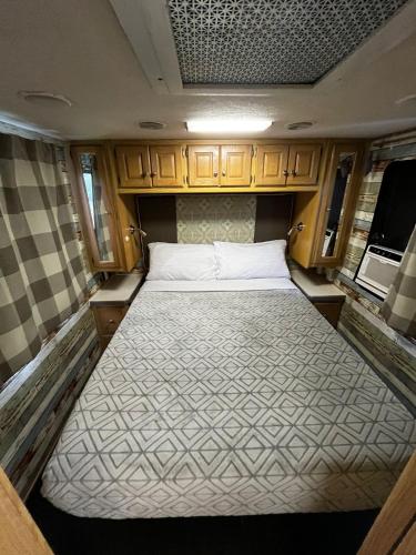 a large bed in the back of an rv at Cozy Private Motorhome near The Falls & Baptist with Parking in Miami