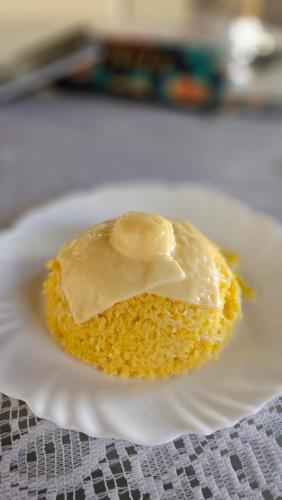 a piece of cake with peanut butter on a white plate at Pousada Flor de Lótus Suites Carneiros in Tamandaré