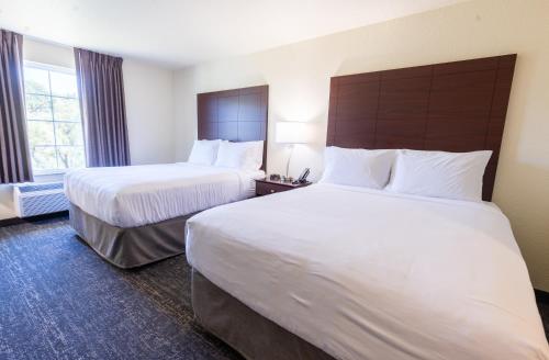 a hotel room with two beds and a window at Cobblestone Inn & Suites - Winters in Winters
