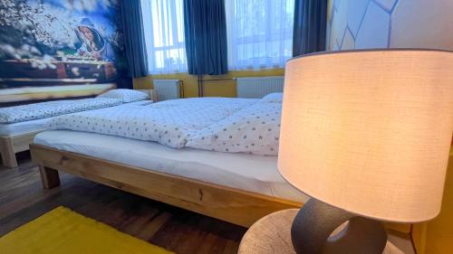 Katil atau katil-katil dalam bilik di Apartmány SVRČINKY