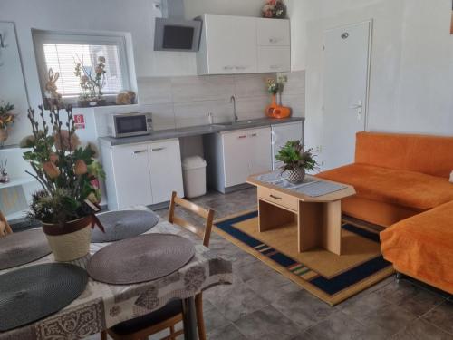 a living room with a couch and a table at Ubytovanie Čereňany in Čereňany