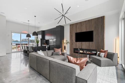 a living room with a couch and a tv at Grand Prix Grandeur at AMP in Dawsonville