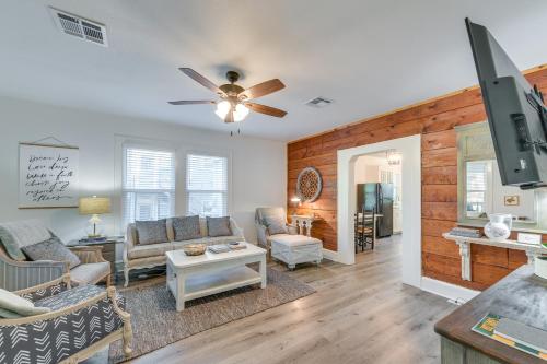 a living room with a couch and a ceiling fan at 3 Mi to Baylor U Home with Shared Yard in Waco