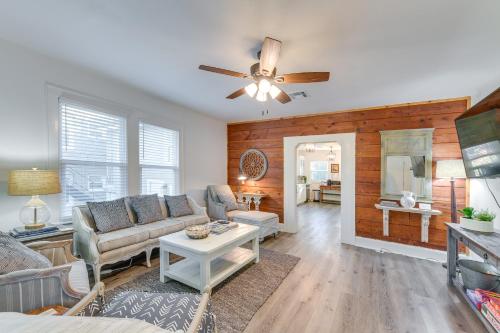 a living room with a couch and a ceiling fan at 3 Mi to Baylor U Home with Shared Yard in Waco