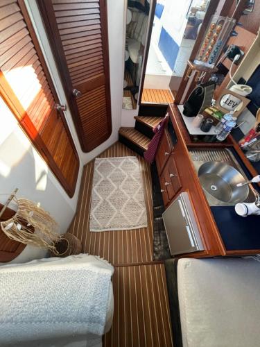 an overhead view of a room with two beds and a sink at Le duplex des Marinas, Mini Yacht in Deauville