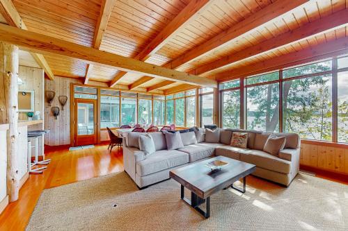a living room with a couch and a table at Hayden Lake Hideaway in Hayden Lake