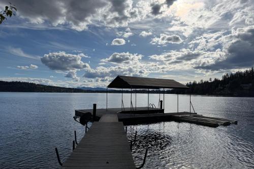 a dock in the middle of a lake at Hayden Lake Hideaway in Hayden Lake