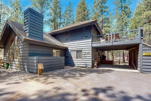 a house with a deck on the side of it at Haddon Lodge in Black Butte Ranch