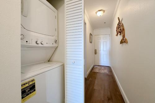 a kitchen with a stove and a refrigerator at Grand Caribbean East & West W305 in Perdido Key