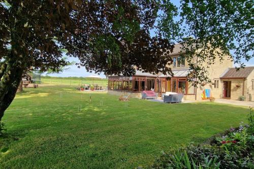 a house with a large yard with a yard at Stud House in Private Country Estate near Bruton in Gillingham