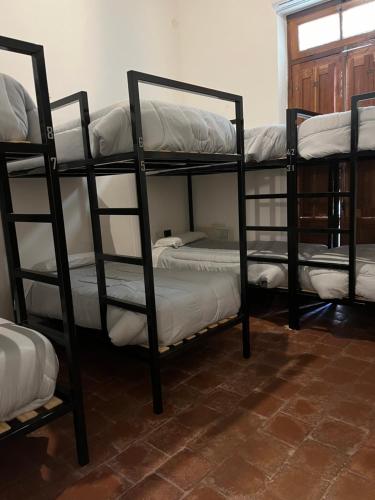 Postel nebo postele na pokoji v ubytování La Félicité Hostel