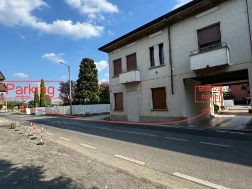an empty street in front of a building at Brianza Home in Giussano