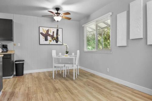 a dining room with a table and a ceiling fan at Fully Furnished King Bed 1B1B by Tech Giants & Stanford Near SFO in San Mateo