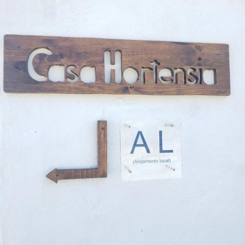 a sign that says eastern horeans hanging on a wall at Casa Hortensia in Cardigos