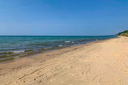 a sandy beach with the ocean in the background at Lake Bluff in Watervliet