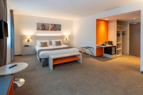 Postel nebo postele na pokoji v ubytování Best Western Colmar Expo