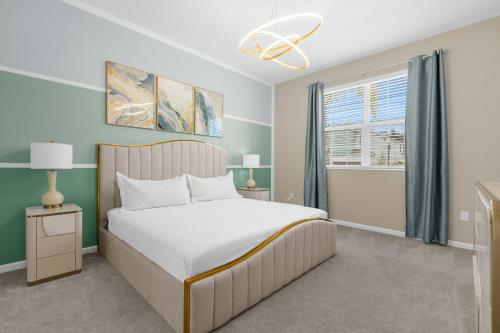 a bedroom with a large bed and a window at Upstay - Themed Family Home w Pool & Games Room in Kissimmee