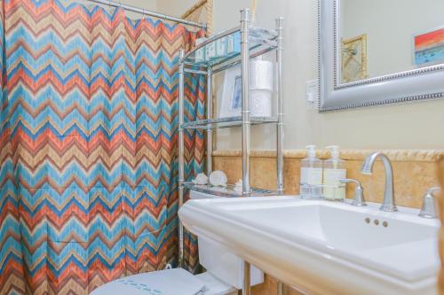 a bathroom with a sink and a toilet at Las Olas 1 in Puerto Peñasco