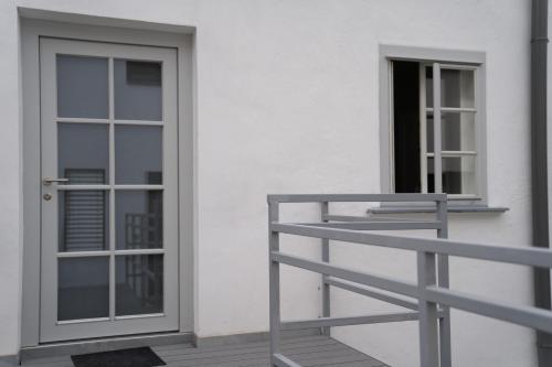 a door on the side of a building at Beautiful Central City Apartment - 2BR, WIFI, Netflix & PS4 in Klosterneuburg