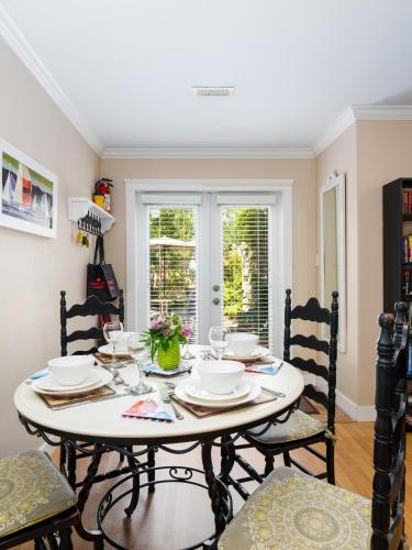 a dining room with a table and chairs at Ferry Walk House in West Vancouver