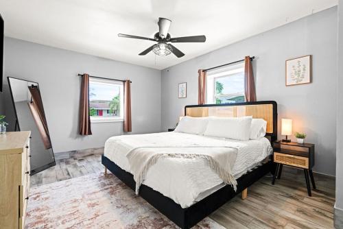 a bedroom with a bed and a ceiling fan at October Special! Limited-time Discount Book Now! in Jupiter