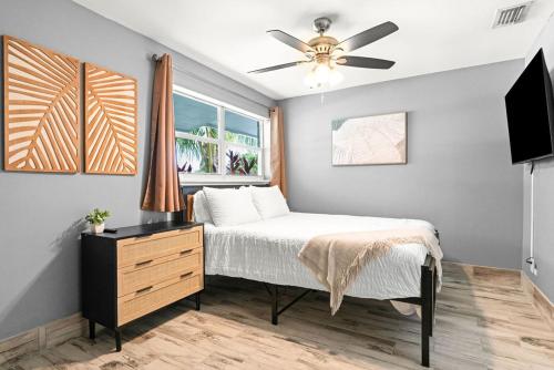 a bedroom with a bed and a ceiling fan at October Special! Limited-time Discount Book Now! in Jupiter