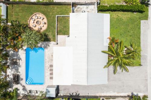 an overhead view of a white building and a swimming pool at October Special! Limited-time Discount Book Now! in Jupiter